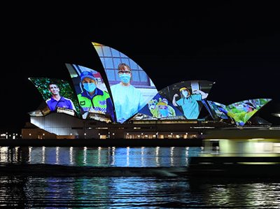 Opera house lights up as NSW sails past vaccination milestone